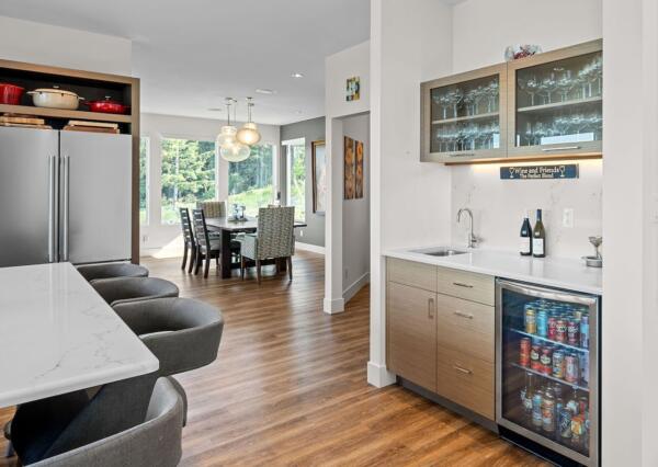 Beverage station with bar fridge in custom design kitchen