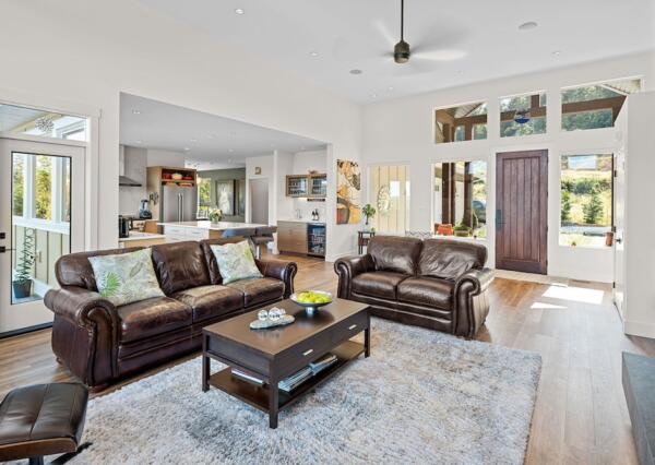 Open concept great room with wood flooring