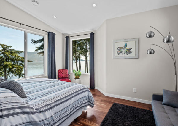 Guest bedroom in custom home with ocean views