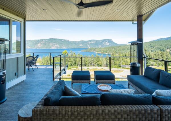 Large covered deck with glass railings