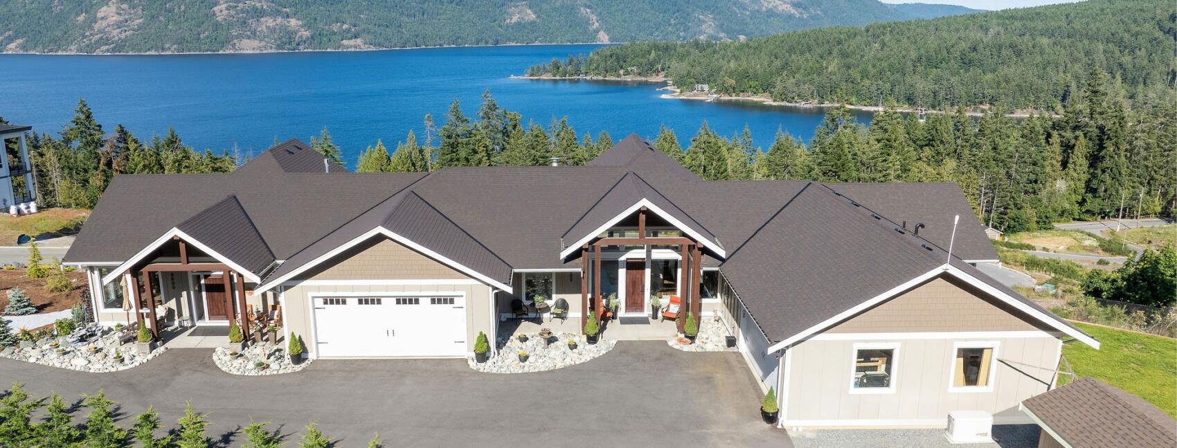 Oceanview Duplex home with board and batten siding in Maple Bay