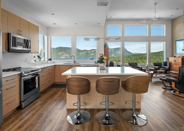 Oceanview from light wood kitchen in Maple Bay custom home