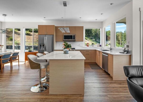 Light wood kitchen design in Maple Bay custom home