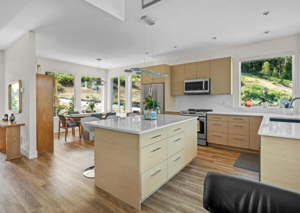 Light wood kitchen with ocean and mountain views