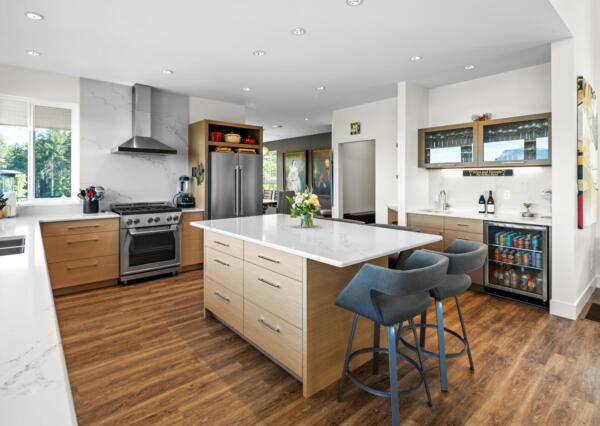 Light wood kitchen with island and bar area