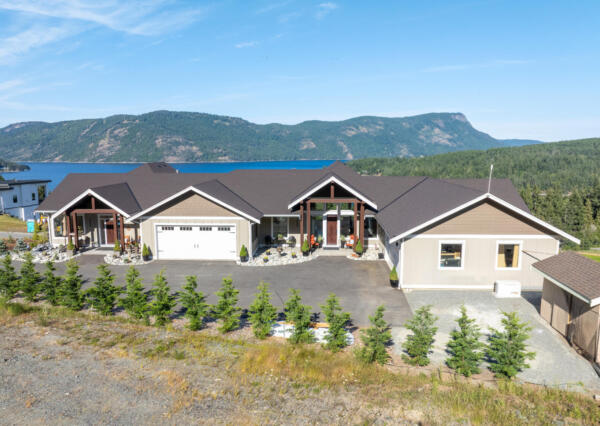 Oceanfront duplex with large garages and timber framed front entrances