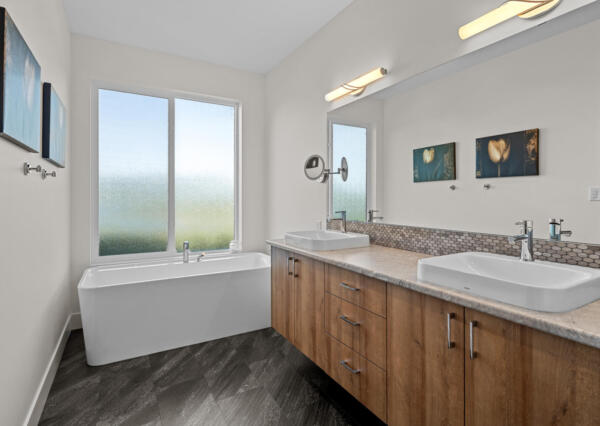 Bathroom with double vanity and freestanding bathtub