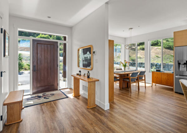 Front entrance with large wood door and large windows