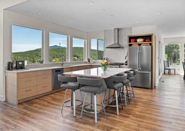 Mountain views from custom light wood kitchen