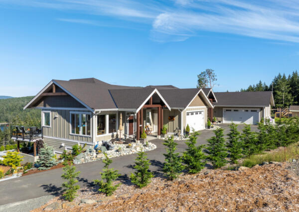 Board and batten siding with landscaping in Maple Bay