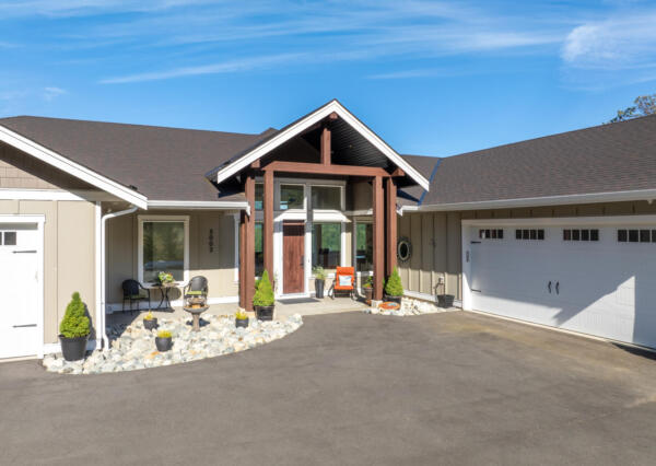 Timber Frame covered front entrance in oceanview home