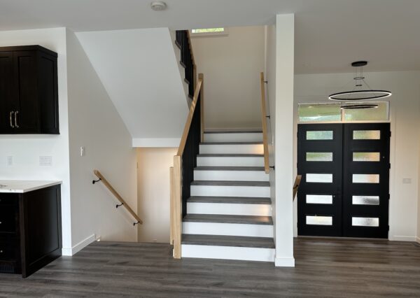 Front entrance and stairwell in custom home