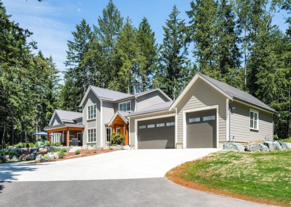 Triple car garage with large driveway