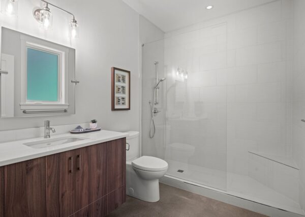 Guest bathroom with shower and concrete floor