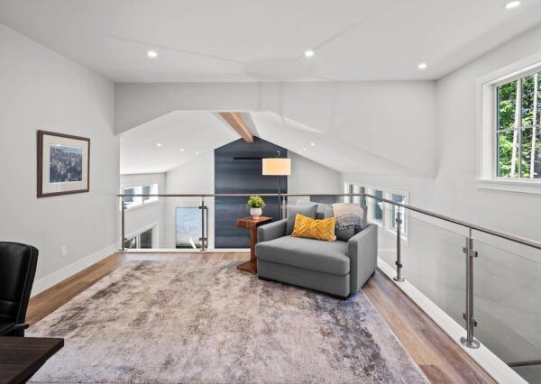 Loft area with glass and metal railings