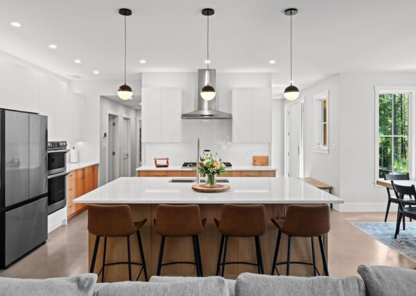 Family kitchen design with wood and white cabinetry