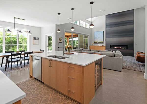 Great room with white paint and concrete floors in custom home