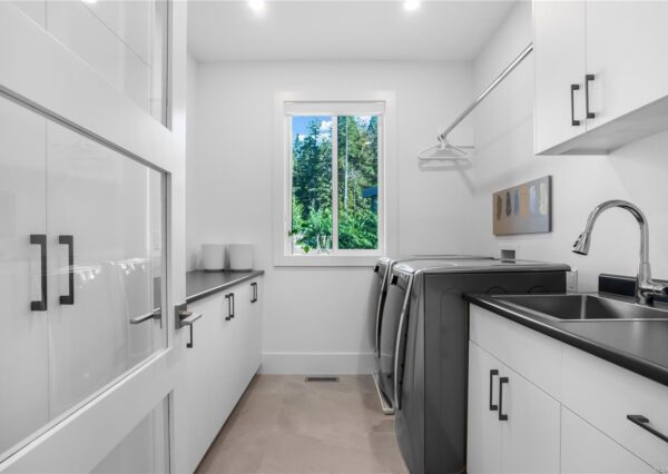 Laundry room with lots of cabinetry and storage