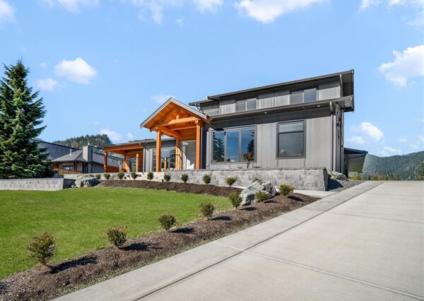 Custom designed home with timber frame front entrance