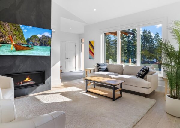 Living room with large windows and gas fireplace