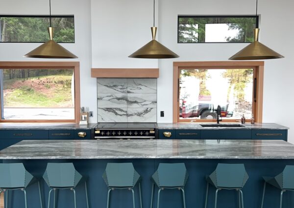 Custom kitchen with blue cabinetry and gold hardware