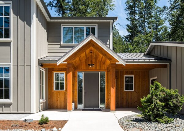 Timber Frame front entrance with wood siding