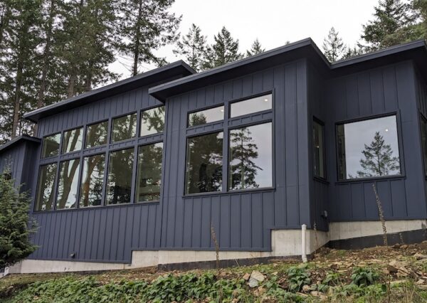 Blue board and batten siding on custom Salt Spring Island home