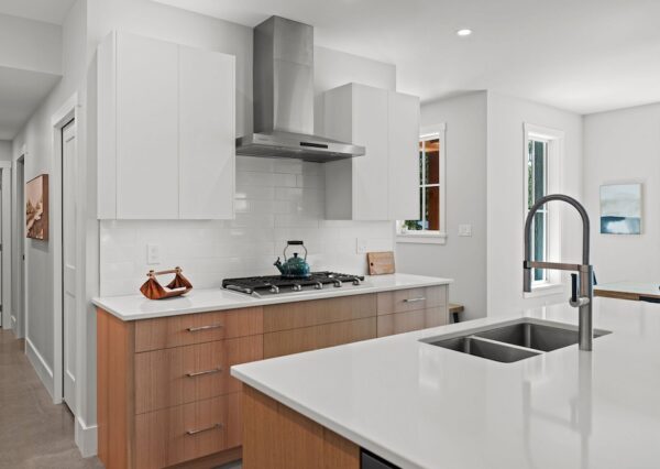 Wood and white cabinetry in custom kitchen